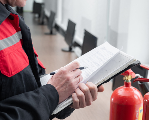 Engineer Professional are Checking A Fire Extinguisher Using Clipboard or checking Industrial fire control system