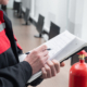 Engineer Professional are Checking A Fire Extinguisher Using Clipboard or checking Industrial fire control system