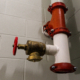 fire hose standpipe system strategy in stairwell with concrete wall background