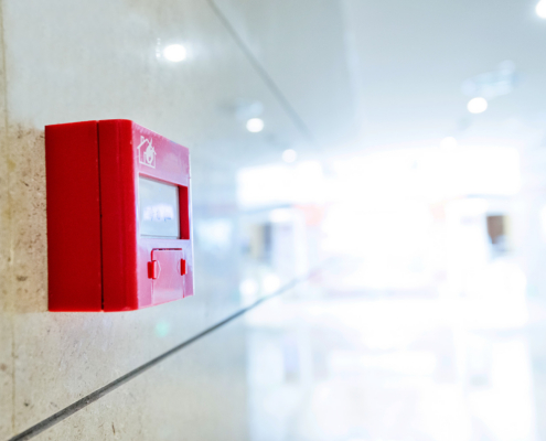 Fire alarm on wall of hospital corridor