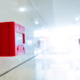 Fire alarm on wall of hospital corridor